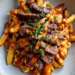 Carne Asada Fries With Sliced Steak and Chile Butter Sauce