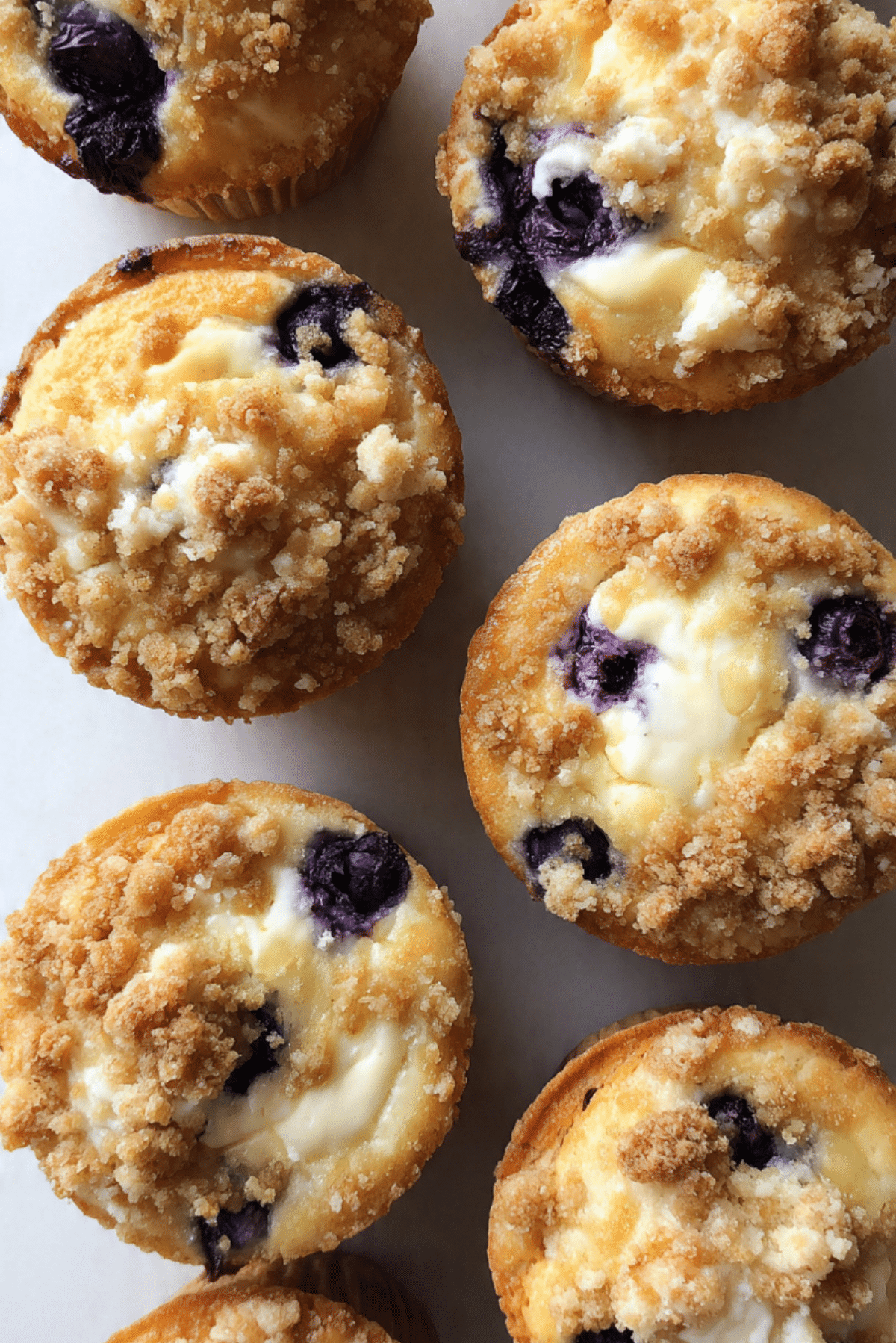 Blueberry Cheesecake Stuffed Crumble Muffins